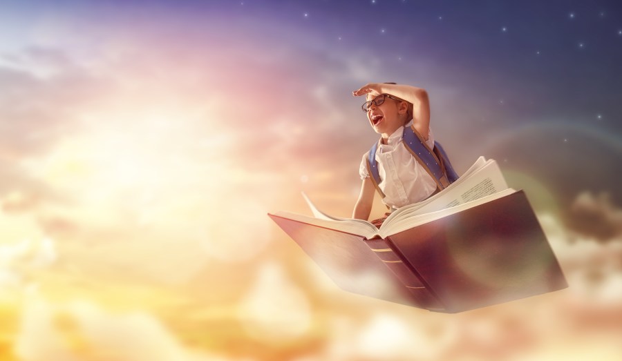child flying on the book